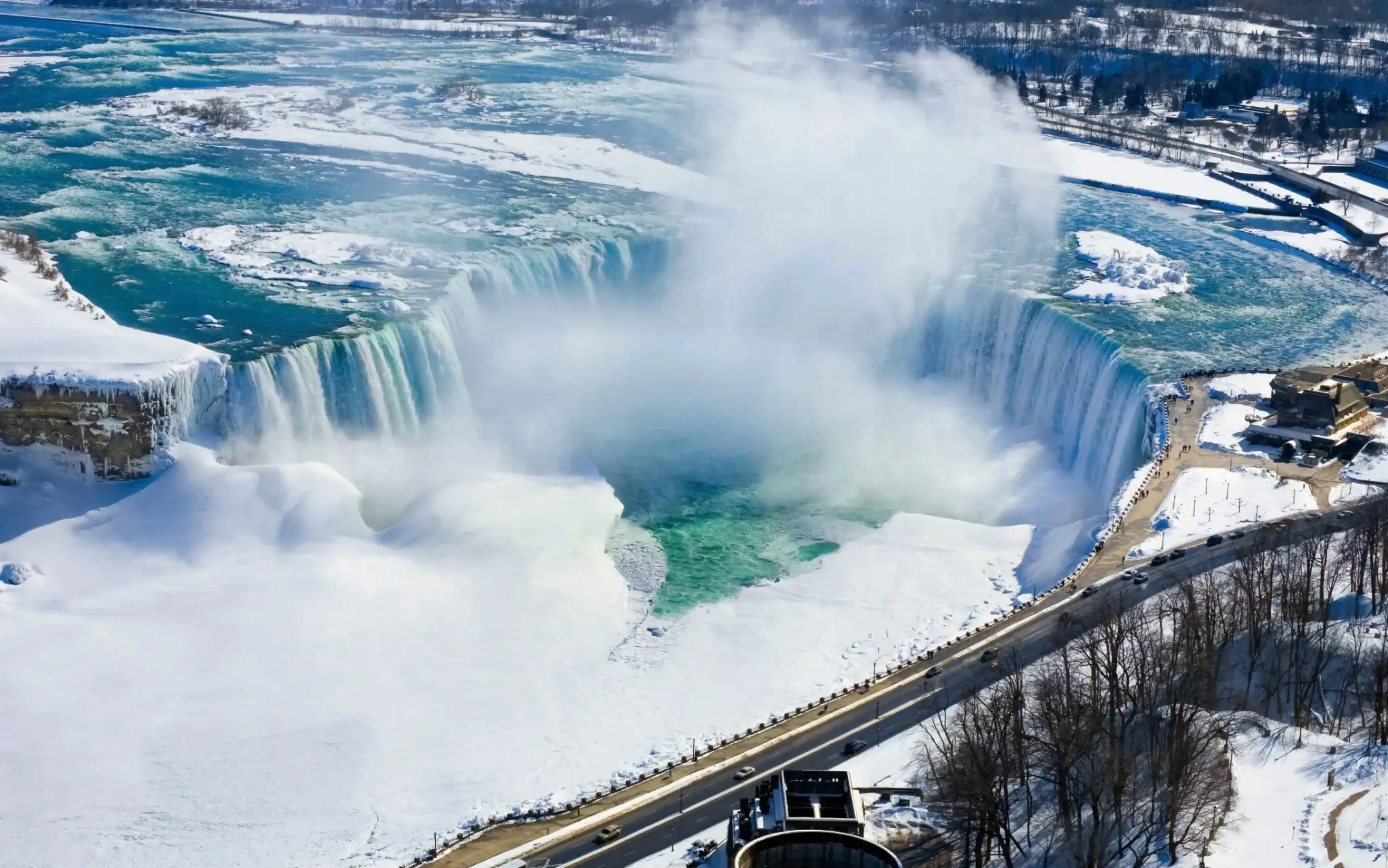 "Aerial view of Niagara Falls in winter with snow and mist, Canada"