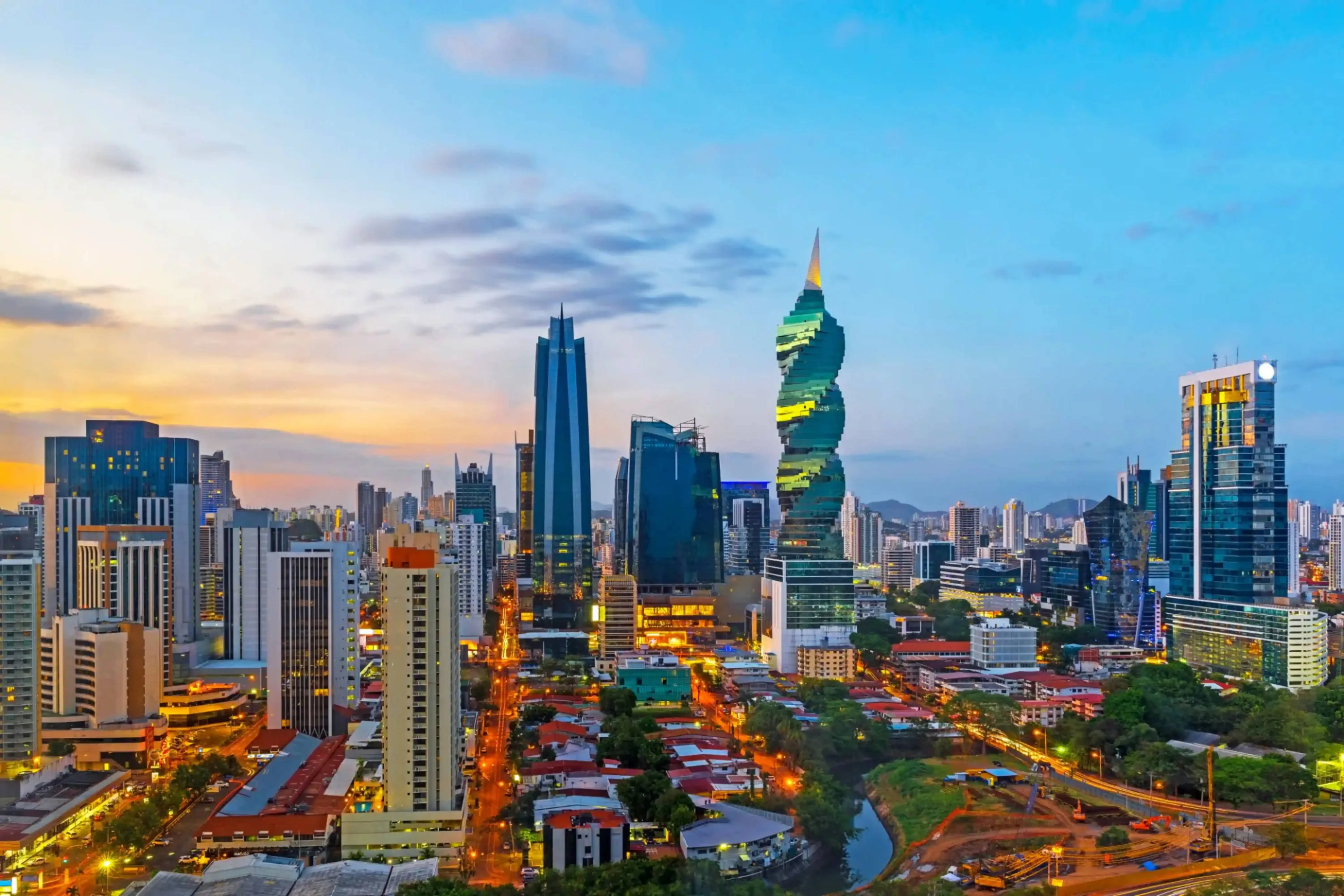 "Panama City skyline with the iconic spiral-shaped F&F Tower at sunset, Panama."