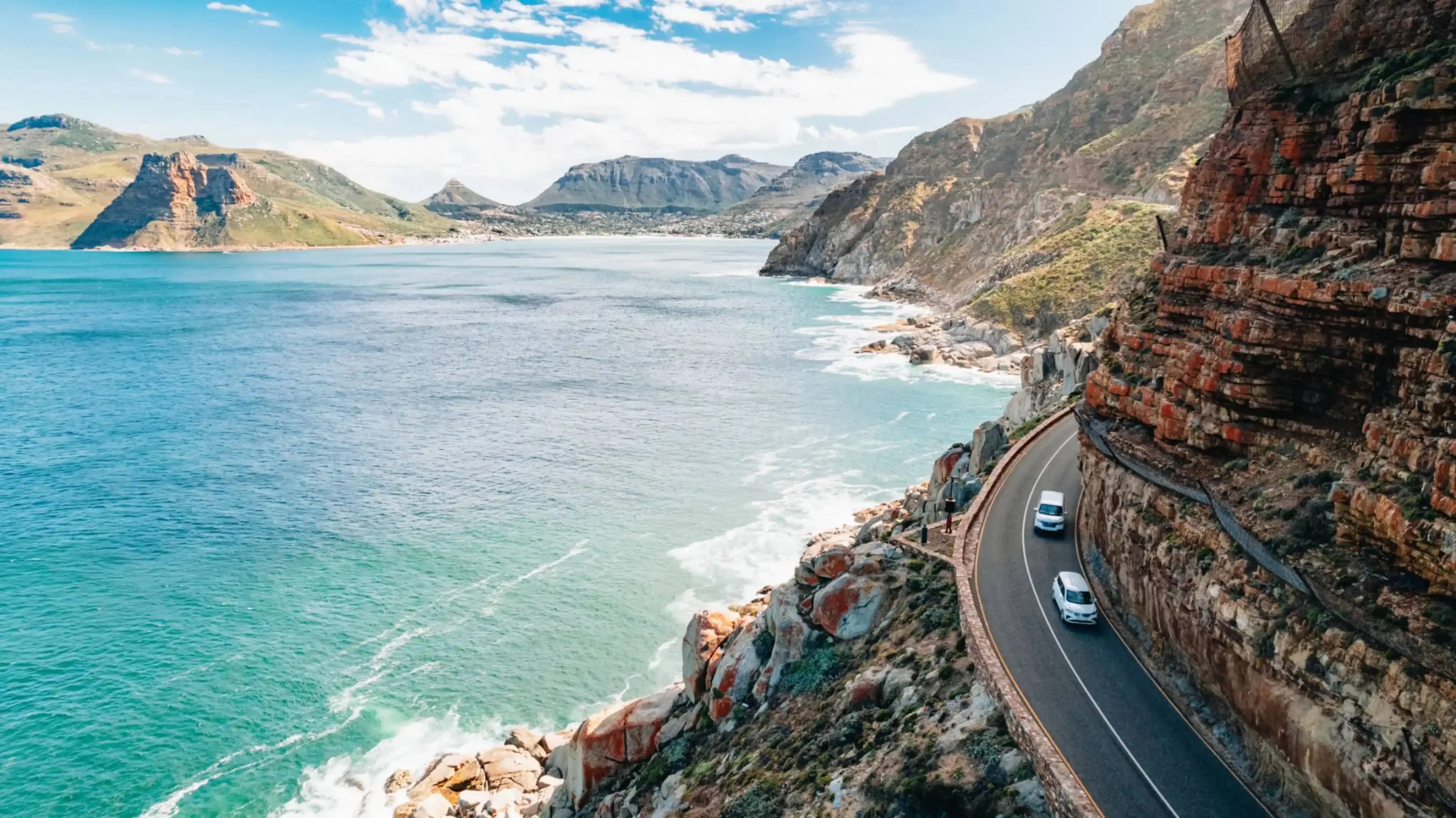 "Scenic drive along Chapman’s Peak Drive overlooking the Atlantic Ocean near Cape Town, South Africa."