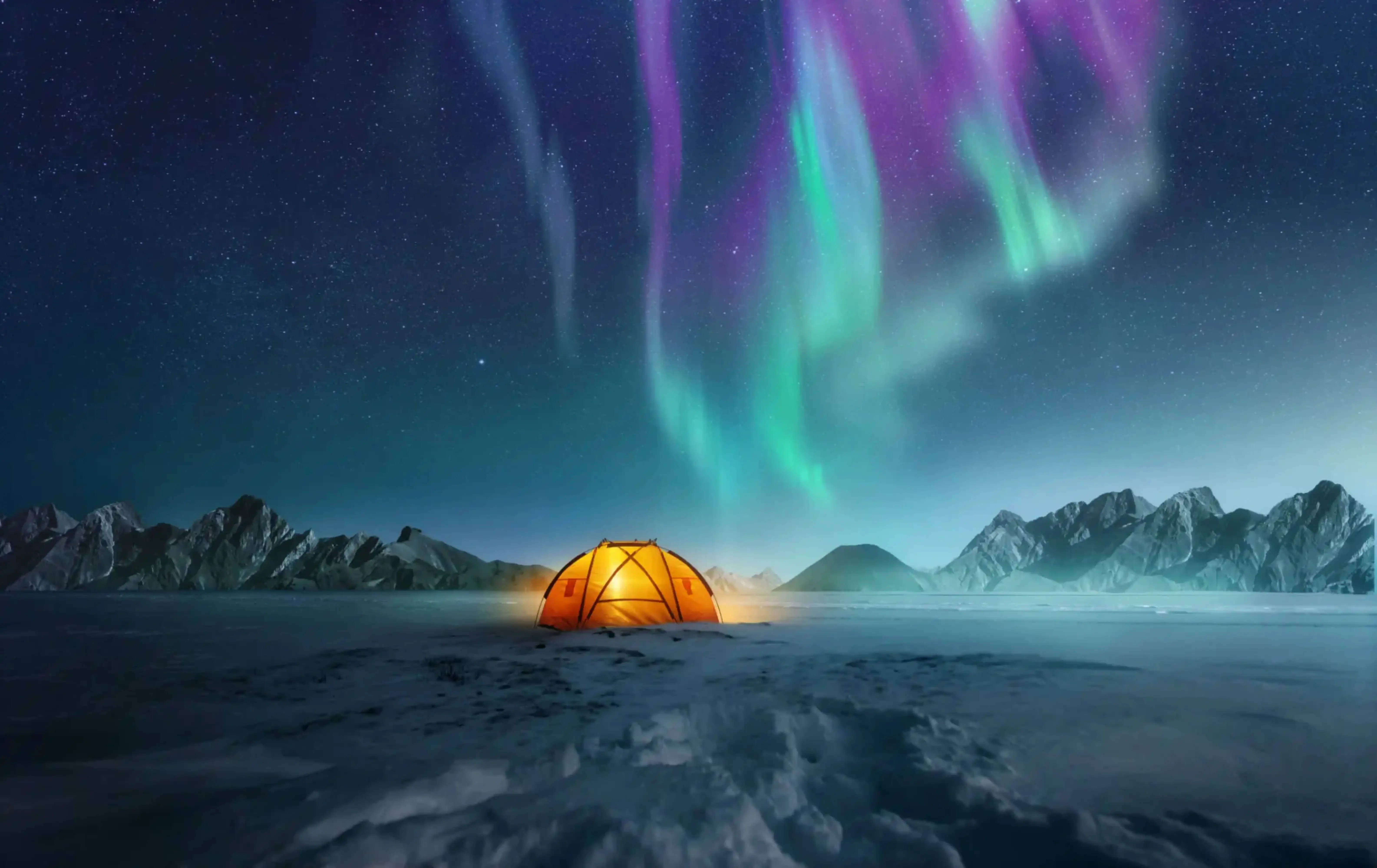 Glowing orange tent in a snowy Arctic landscape under a vivid aurora borealis with green and purple lights dancing across the night sky.