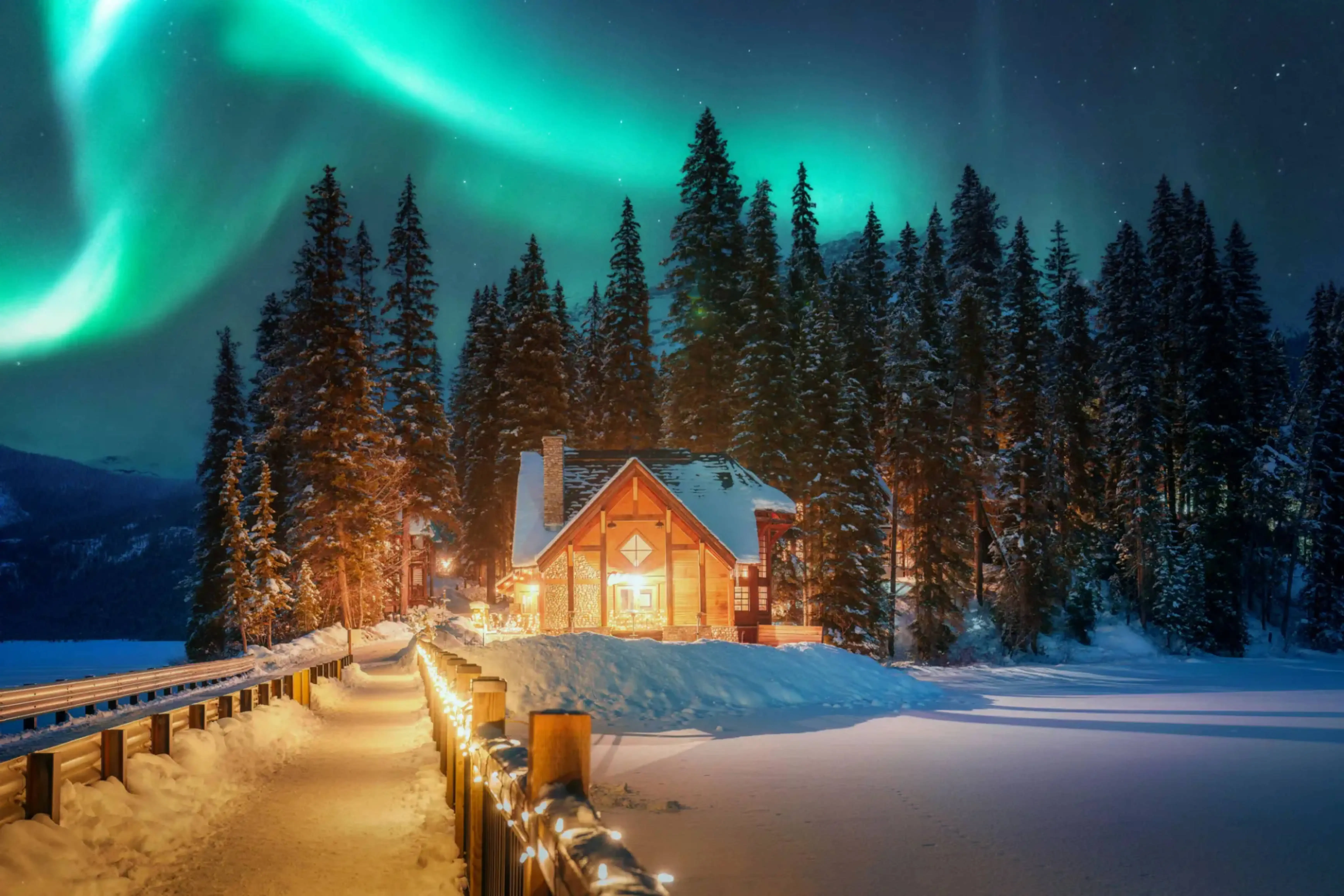 Cozy wooden cabin in a snowy forest illuminated at night under a stunning aurora borealis sky