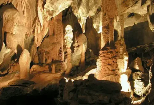"Illuminated stalactites and stalagmites inside Mawsmai Cave in Meghalaya, India"