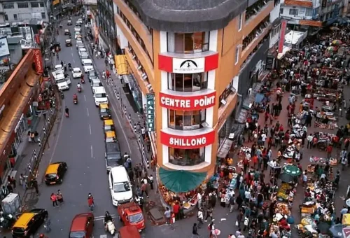 "Aerial view of Police Bazaar with Centre Point building in Shillong, bustling with traffic and crowds"
