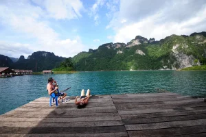 Relaxing at floating pier on Cheow Lan Lake Thailand