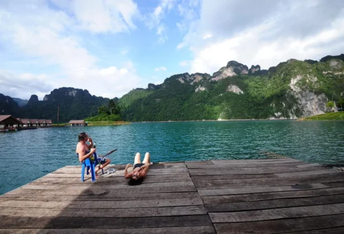Relaxing at floating pier on Cheow Lan Lake Thailand