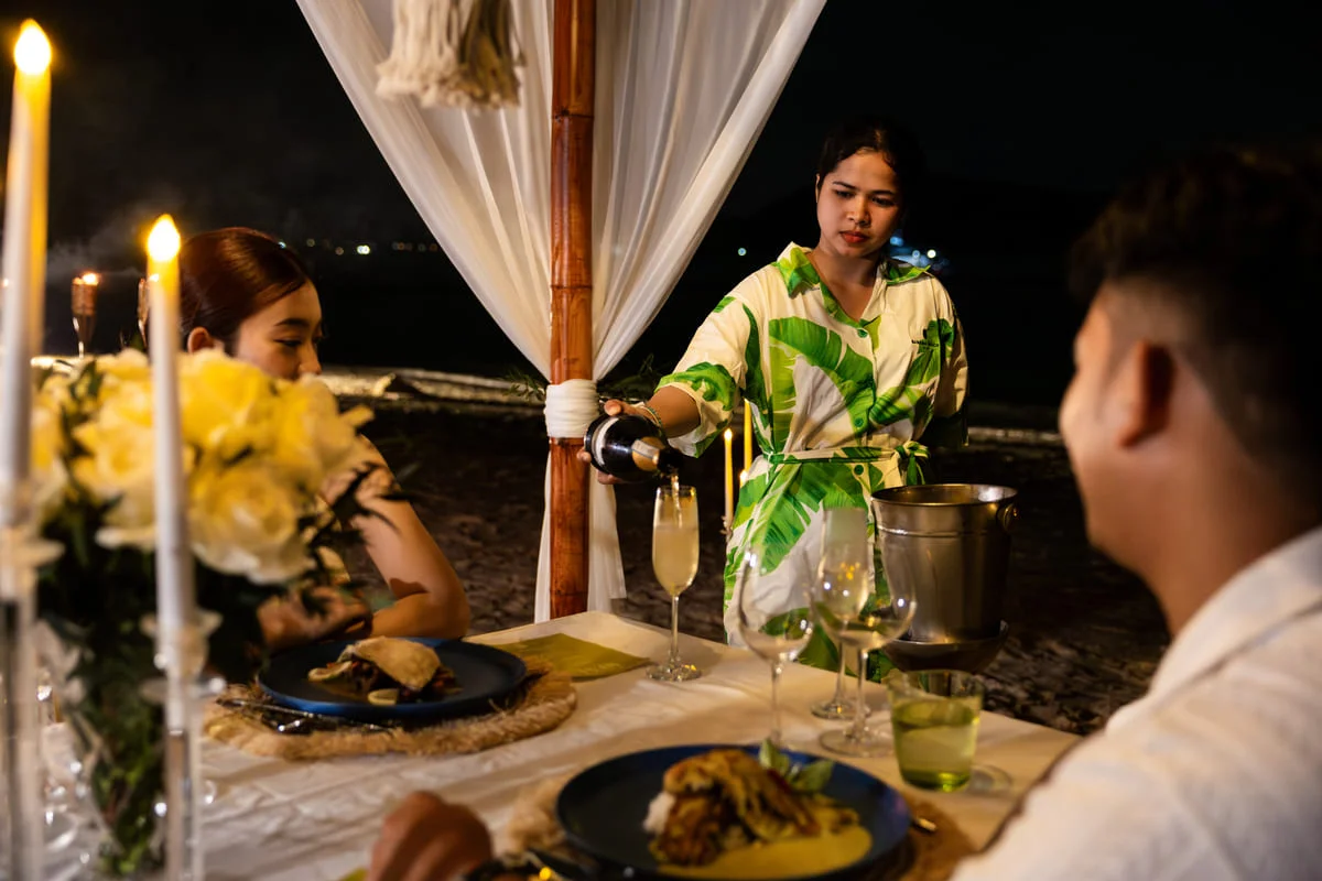 Coral Island beach sunset dining couple relaxing