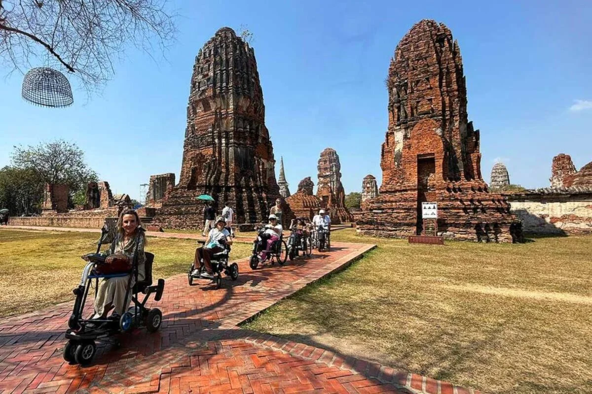 Wheelchair user enjoying an accessible sightseeing tour in Thailand with barrier-free travel.