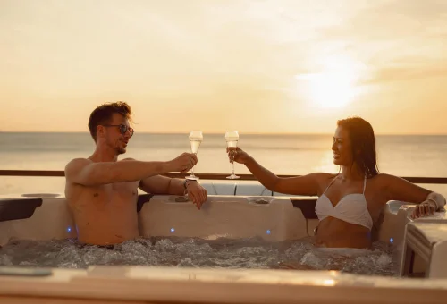 Guests relaxing on the spacious sun deck of a luxury catamaran in Phuket.