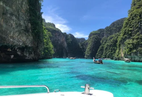 Passenger enjoying a private speedboat tour in the turquoise waters of Phi Phi Islands