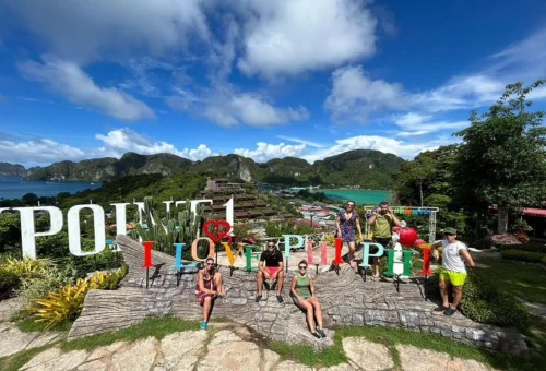Visitors enjoying a scenic viewpoint during a Phi Phi Islands private tour
