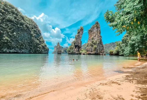 Tropical beach and limestone cliffs on a private boat tour