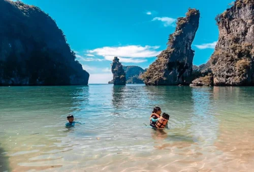 Family swimming near James Bond Island on a private tour
