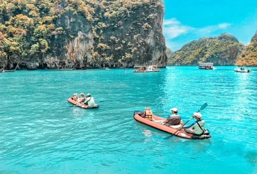 Canoeing in turquoise waters during a private speedboat tour