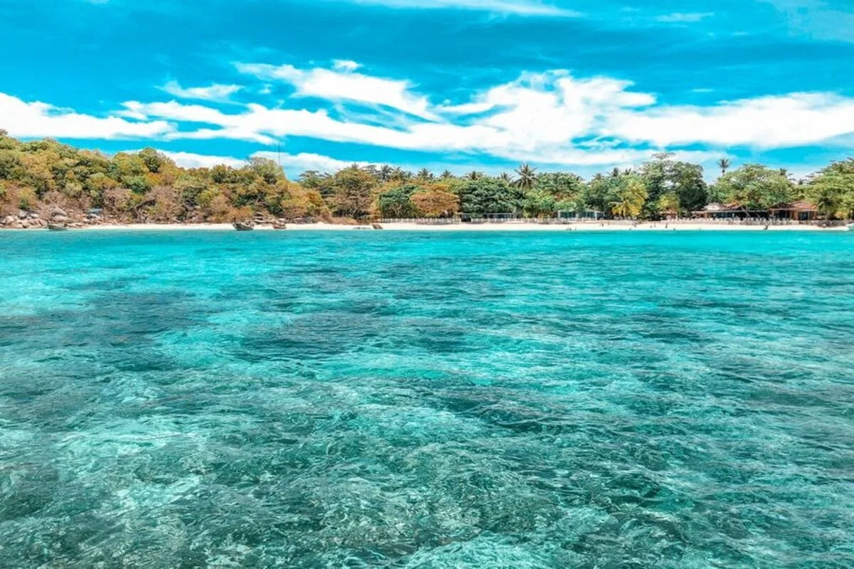 Raya Yai Island beach and turquoise water on private speedboat tour from Phuket