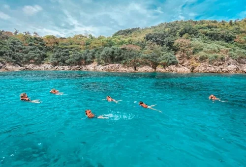 Swimming and snorkeling at Raya Noi Island on private speedboat tour
