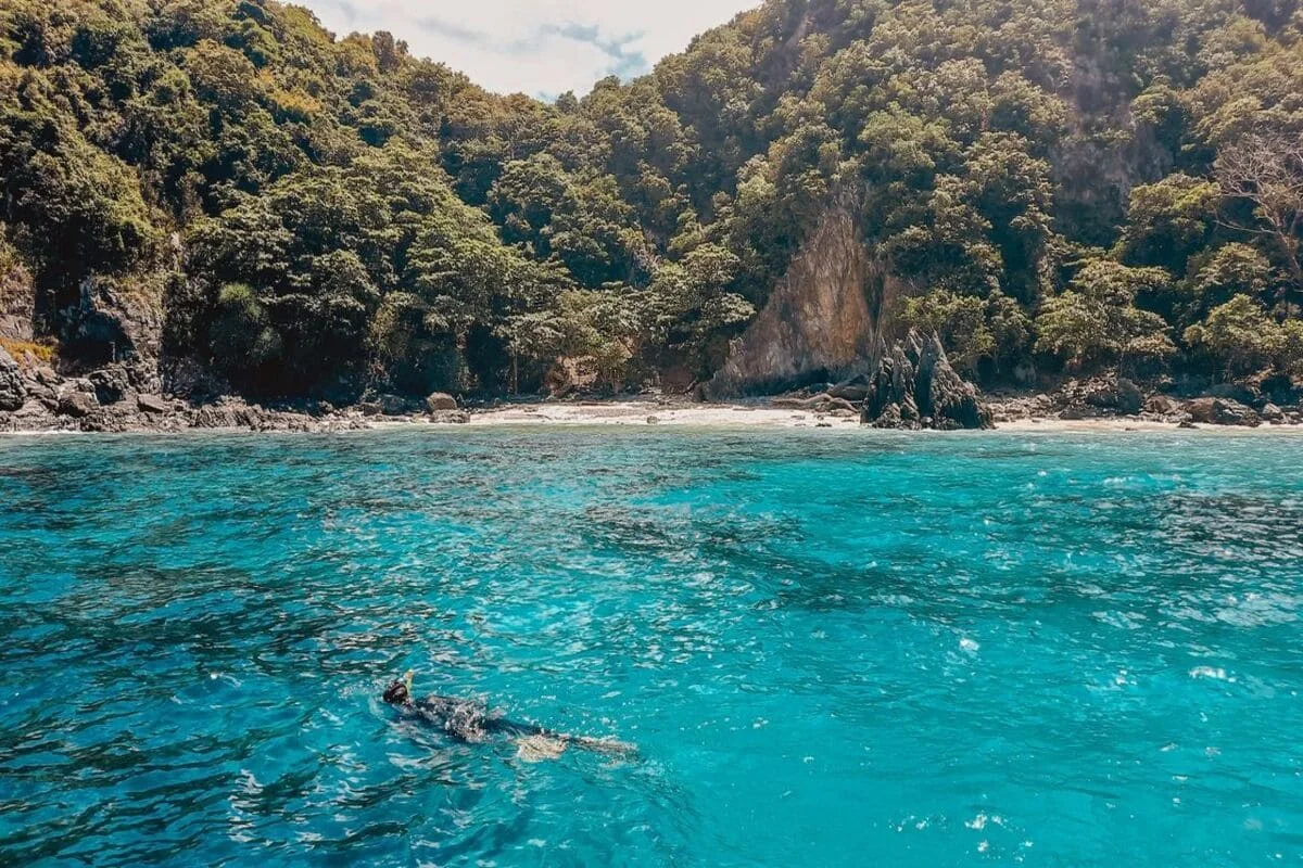 Coral Island Phuket private speedboat tour with snorkeling in clear turquoise water