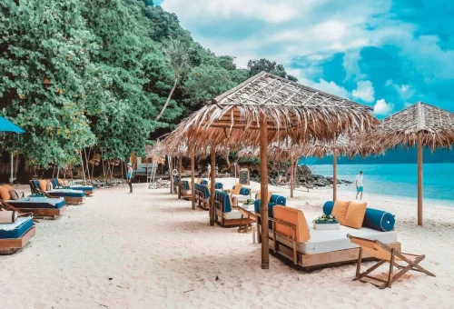 Beautiful Coral Island beach with white sand and turquoise water near Phuket