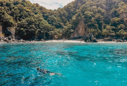 Coral Island Phuket private speedboat tour with snorkeling in clear turquoise water