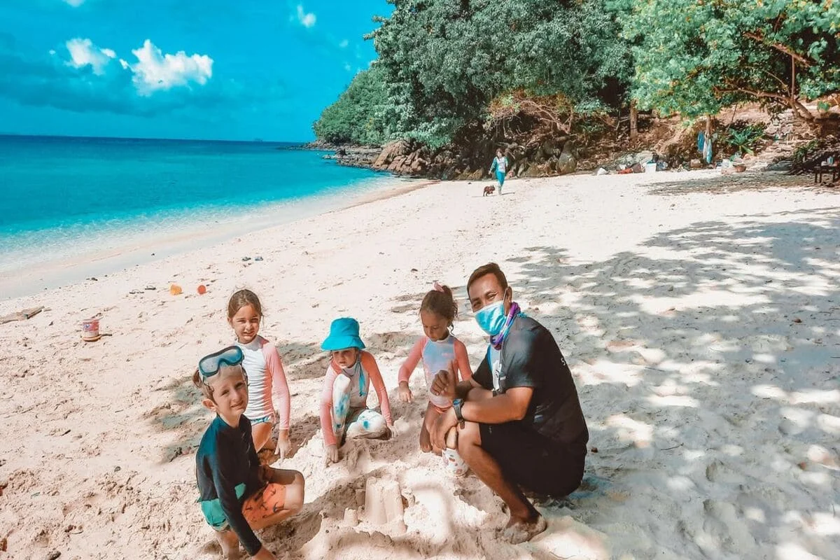 Children enjoying family activities on Coral Island beach Phuket