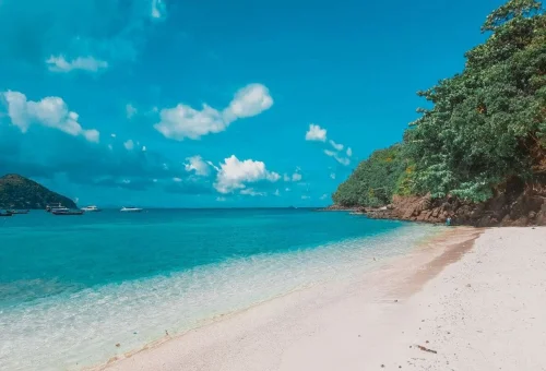 Tropical white-sand beach and turquoise sea at Coral Island Phuket