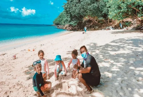Children enjoying family activities on Coral Island beach Phuket