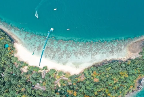 Aerial view of Coral Island beach and turquoise sea near Phuket