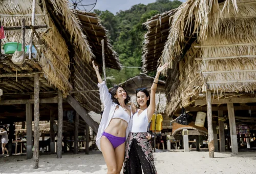 Visitors exploring traditional Moken village at Surin Islands