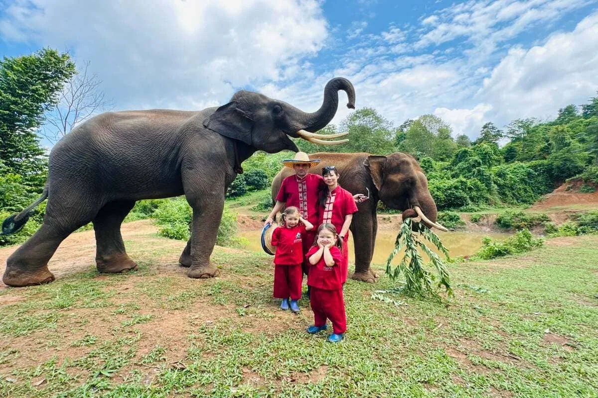 Family enjoying an elephant care experience at Elephant Rescue Park in Chiang Mai