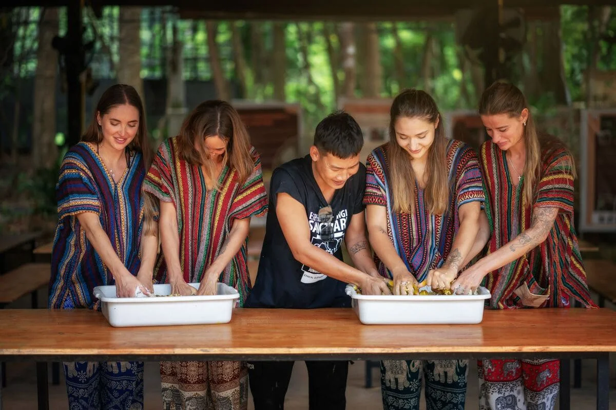 Visitors preparing elephant food during the Phuket Elephant Jungle Sanctuary One Day Walk Experience