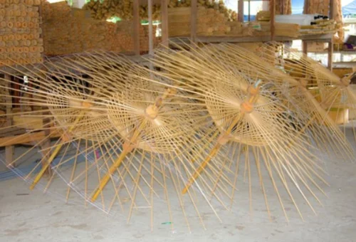 Artisan making traditional umbrellas at San Kamphaeng