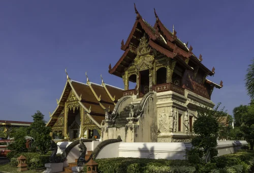 Ornate Lanna temple with detailed gold decorations in Chiang Mai