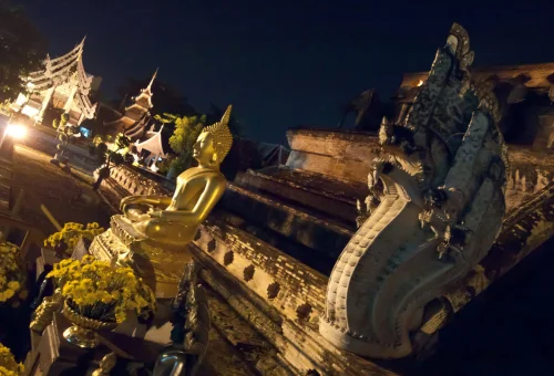 Golden Buddha and Naga sculptures at Wat Chedi Luang