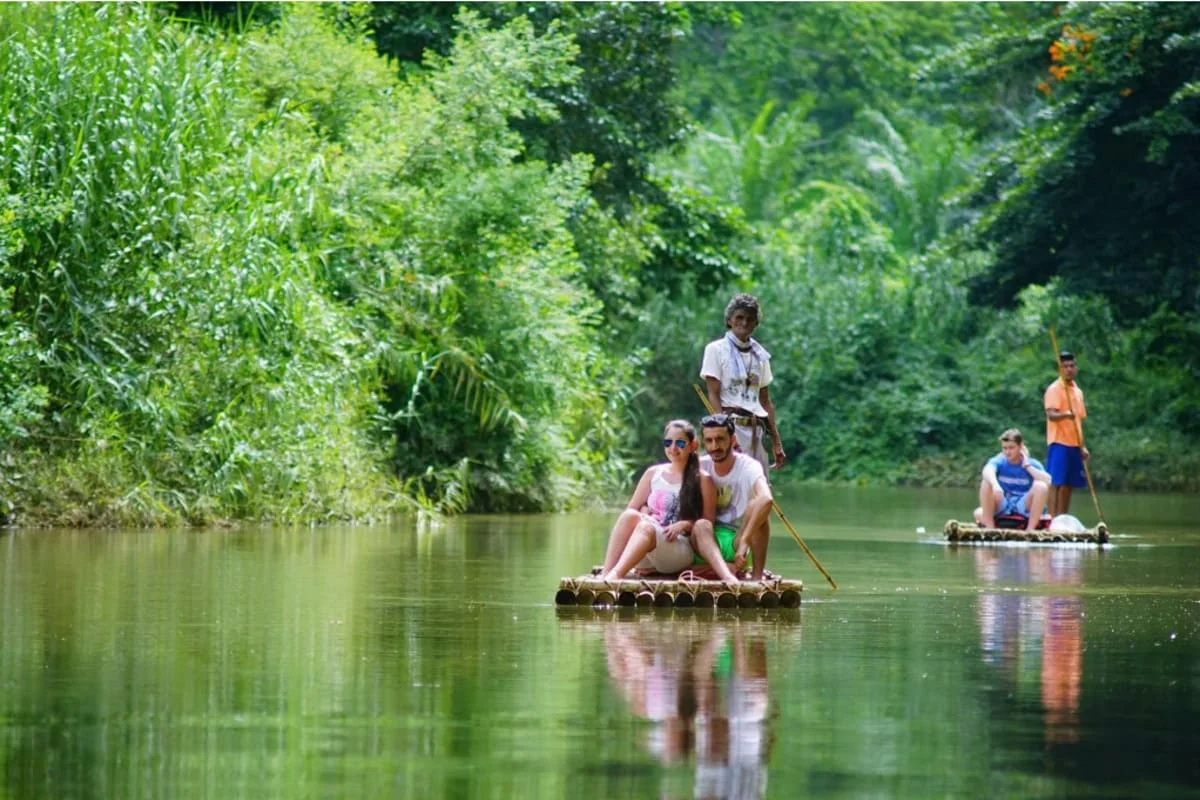 Tourists bamboo rafting on Mae Win River in Mae Wang Chiang Mai