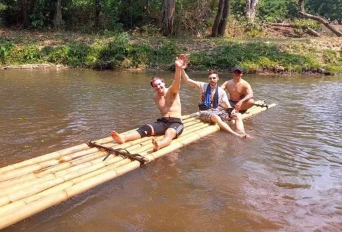 Group enjoying a bamboo rafting tour on Mae Wang River
