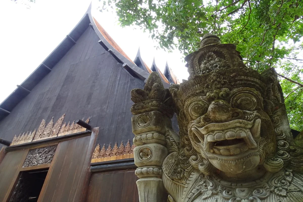Traditional wooden architecture and sculpture at Baan Dam Chiang Rai
