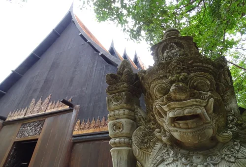 Traditional wooden architecture and sculpture at Baan Dam Chiang Rai