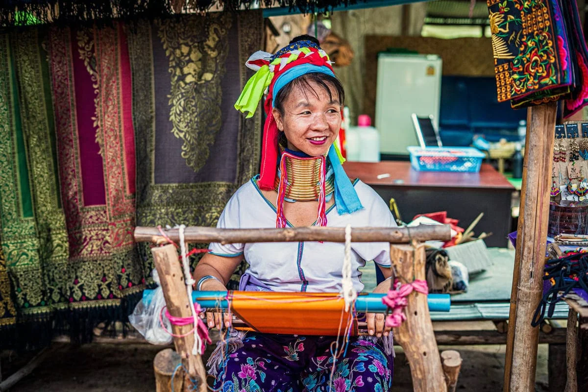 Hill tribe woman making traditional textiles in Chiang Rai