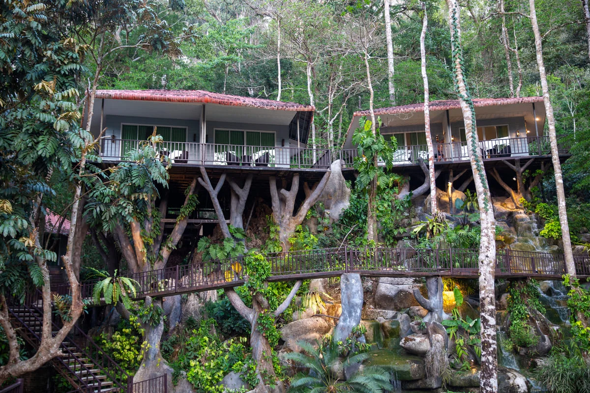ungle accommodation nestled among tropical trees at Rock and Treehouse Resort in Khao Sok