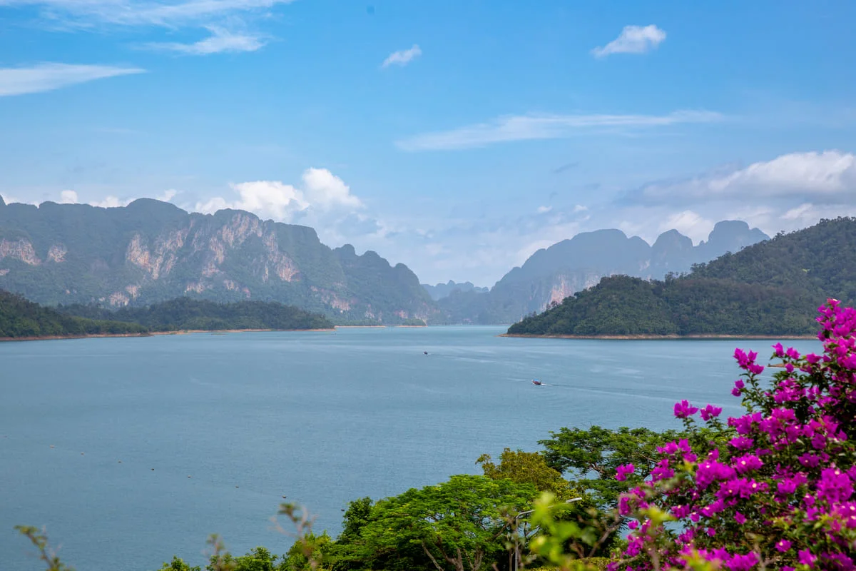 Panoramic view of Cheow Lan Lake with emerald water, green islands and limestone mountains