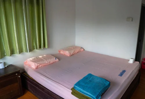 Simple bedroom inside a floating bungalow on Cheow Lan Lake in Khao Sok National Park