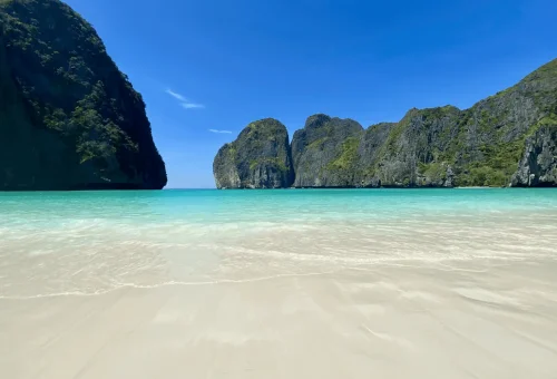 View of Maya Bay, made famous by Leonardo DiCaprio’s movie The Beach — turquoise waters, white sand, and towering cliffs, seen during the X-Large Early Bird tour.