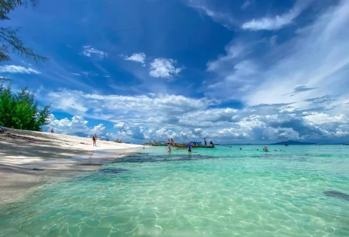 Bamboo Island in the Phi Phi archipelago — white sandy beach, clear turquoise water, and lush greenery, captured during the X-Large Early Bird tour.