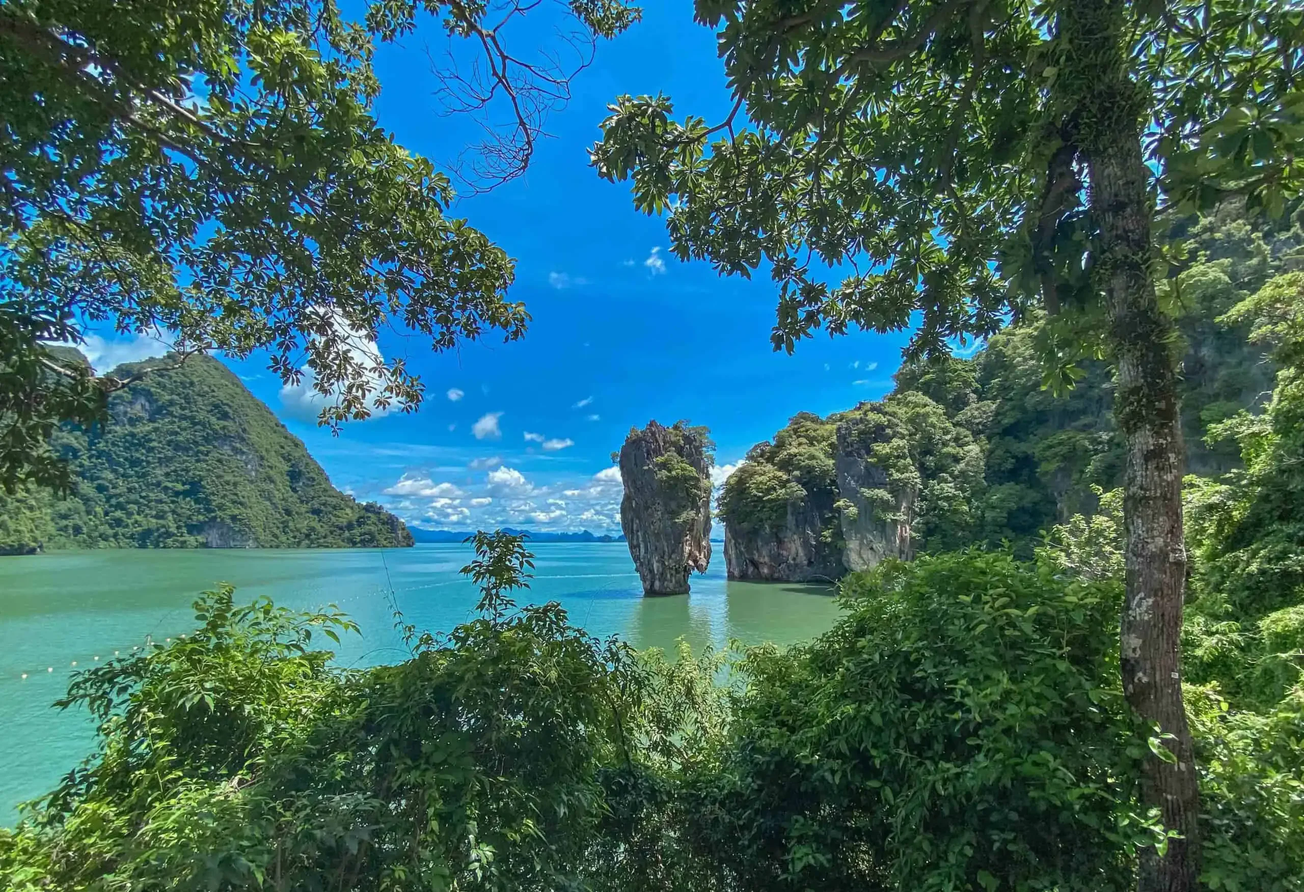 Iconic view of Koh Tapu, the famous “James Bond Island,” rising from the sea with towering cliffs and calm emerald waters — part of the early departure tour from Phuket.