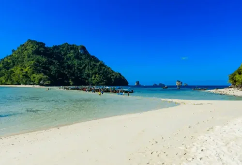 Beautiful sandbar beach in Krabi connecting islands with soft white sand and shallow turquoise waters, perfect for walking and relaxing.