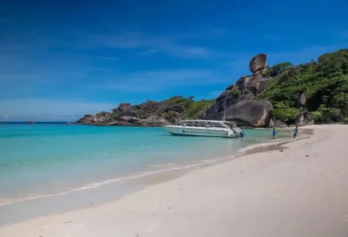 Scenic morning view of Similan Island with clear blue sky, turquoise sea, and white sandy beach, marking the start of the tourist season on October 15, 2025.