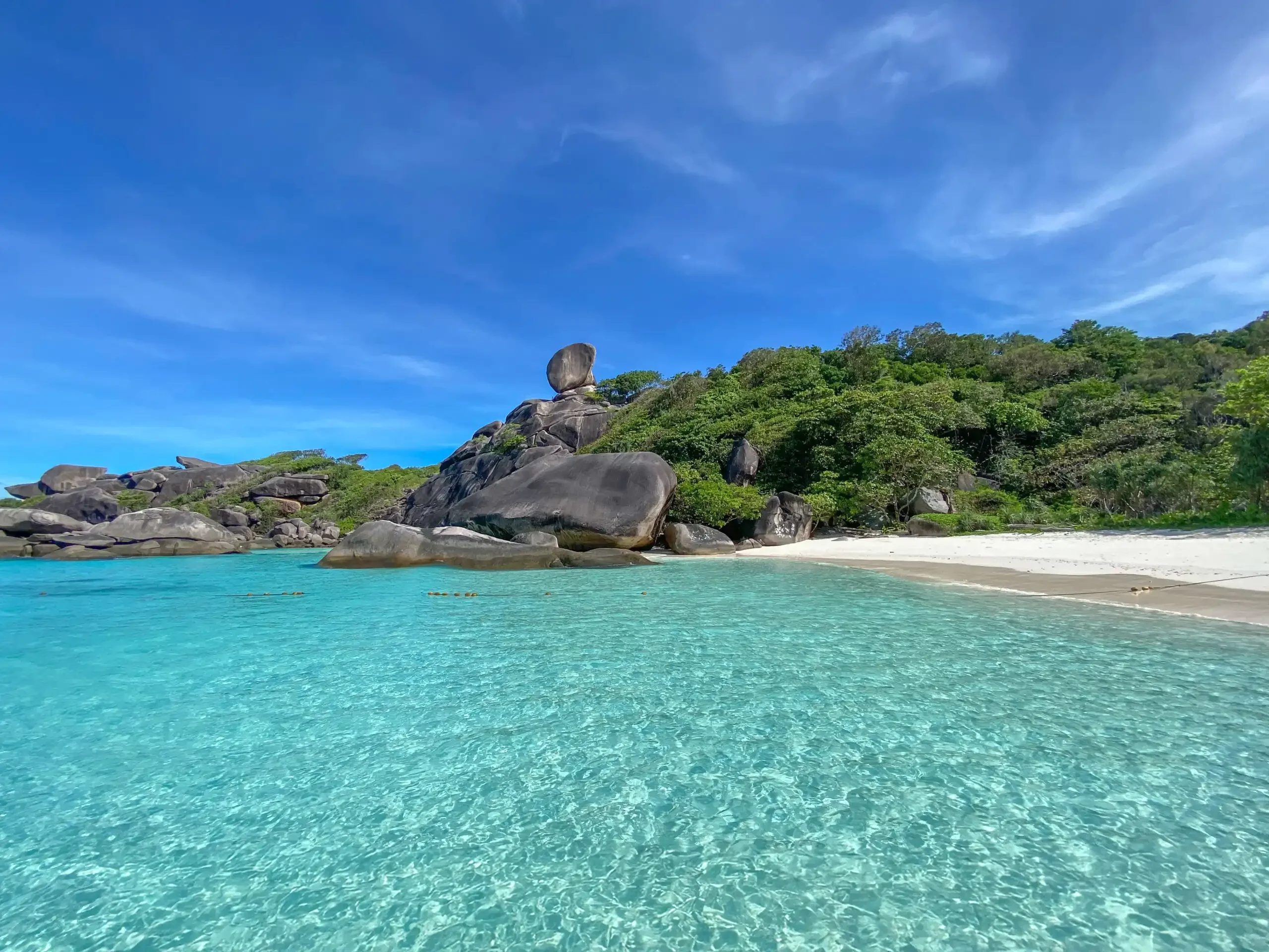 Famous Sailing Rock landmark at Similan Island, a large granite boulder balanced atop a cliff with panoramic sea views