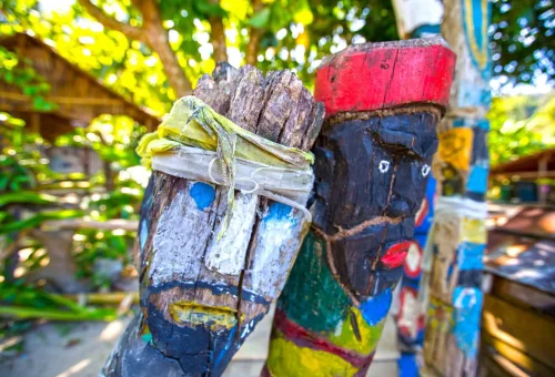 Handcrafted items made by the Moken people at Surin Island, including woven baskets and traditional tools displayed on a wooden table