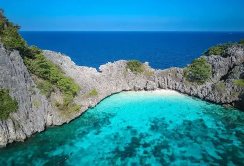 Aerial view of Koh Haa’s cluster of limestone islets surrounded by turquoise water, coral reefs, and a hidden lagoon