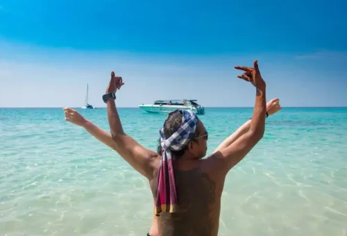 Idyllic view of Koh Kradan with white sandy beach, crystal-clear turquoise water, and lush tropical surroundings