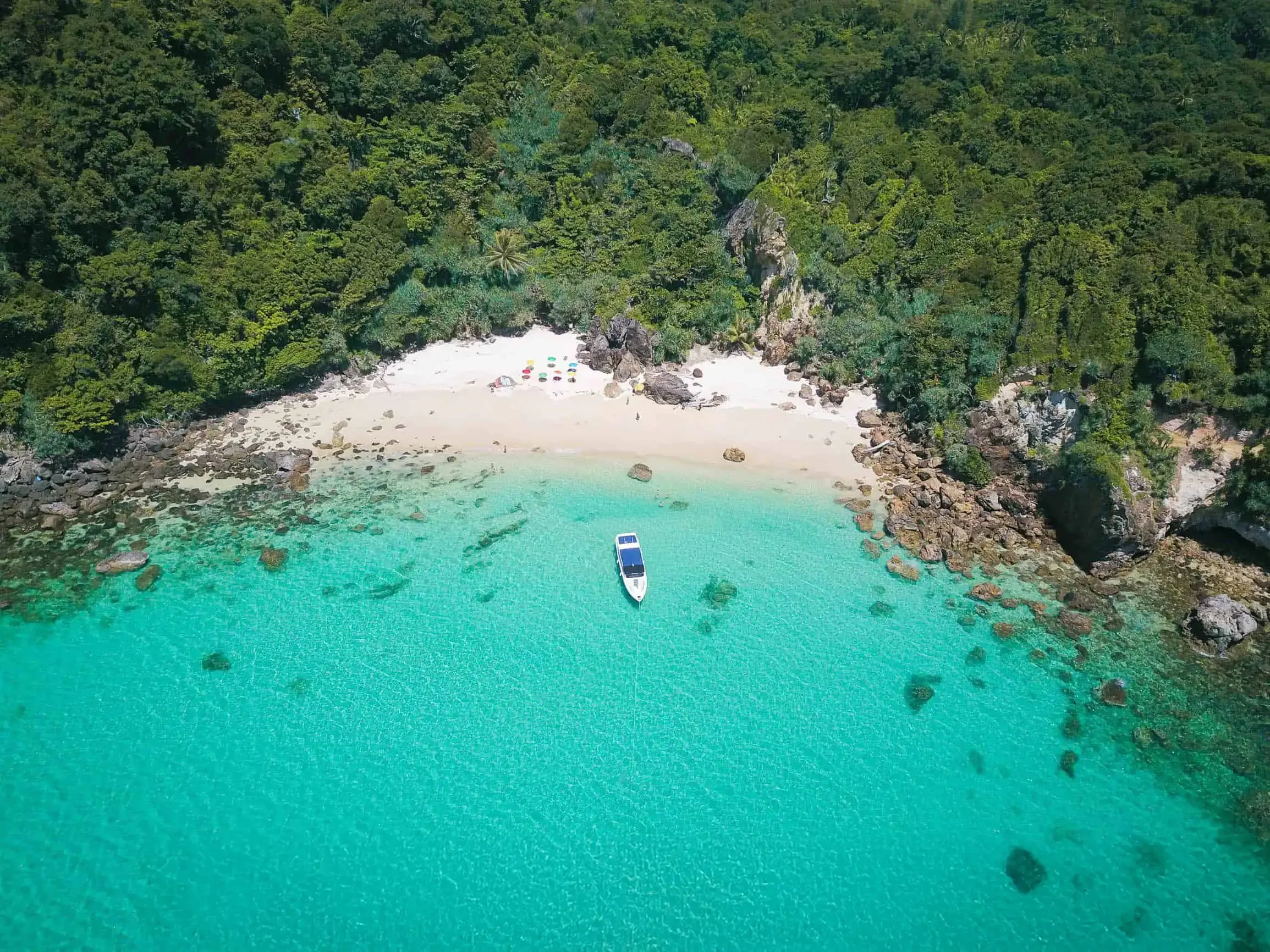 Phuket Travel Store logo with a backdrop of iconic Thai landmarks and the text 'Thailand’s No.1 Tour Agency